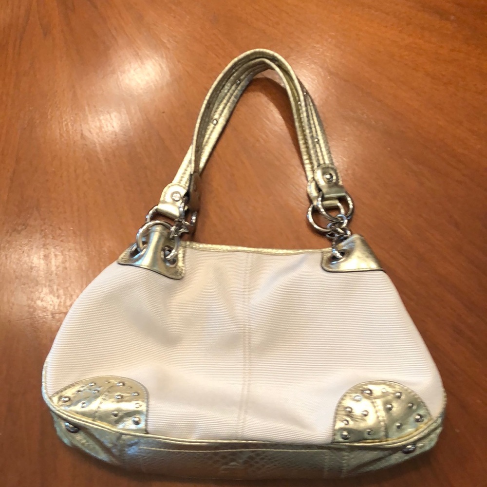 Kathy Van Zeeland canvas bag with gold accents and studs